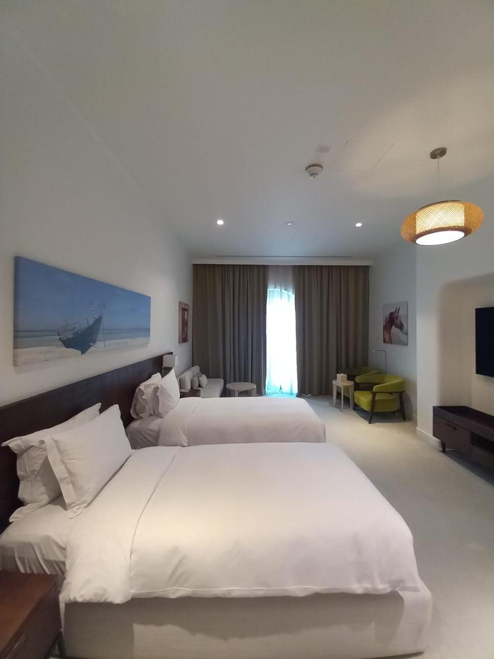 Mina Hotel And Residences By The Torch Doha Extérieur photo A room at the hotel