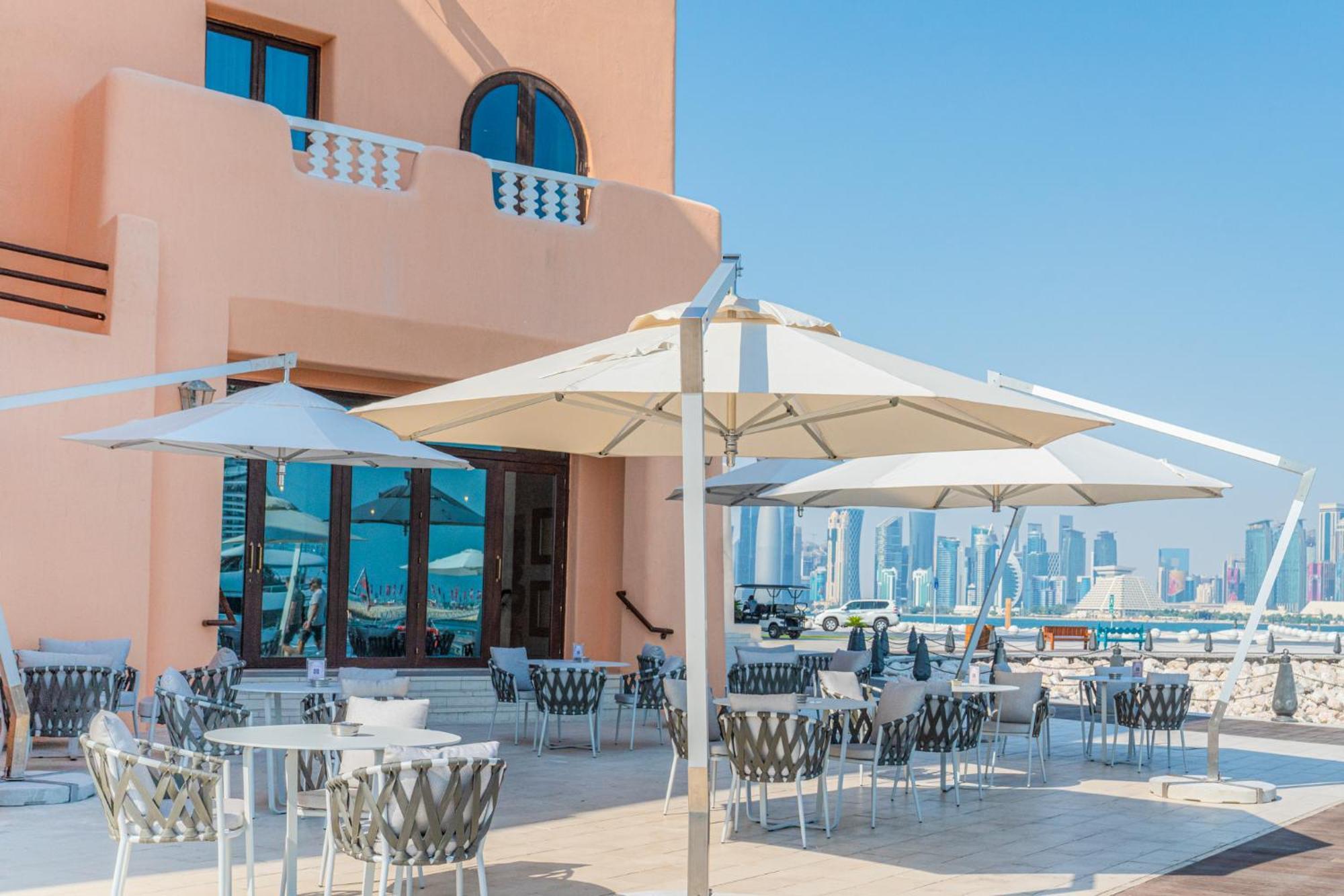 Mina Hotel And Residences By The Torch Doha Extérieur photo A patio umbrella