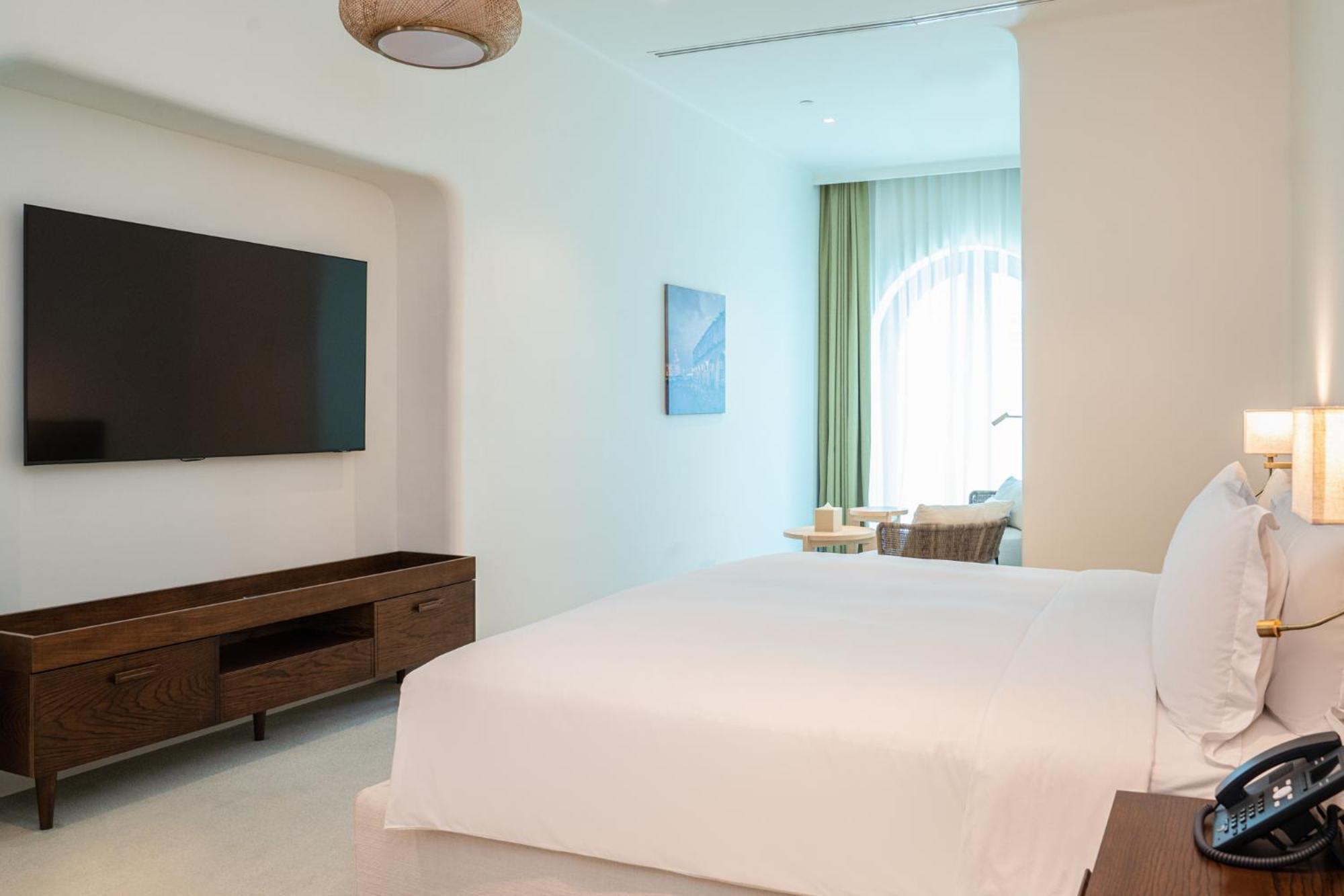 Mina Hotel And Residences By The Torch Doha Extérieur photo A bedroom at the hotel